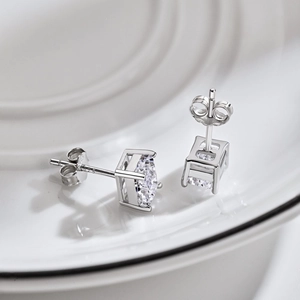 Macro detail of S925 sterling silver square cut studs with four-prong settings