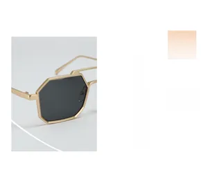 Detailed macro view of retro square double-bridge sunglasses with gold metal frame