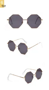 Close-up of square gold frame sunglasses with grey lenses and double bridge design