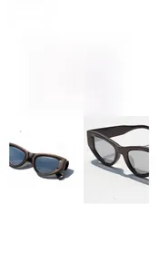 Dettaglio degli occhiali da sole squadrati cat-eye con rivetti a cuore e montura marrone