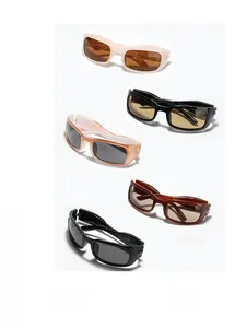 Flat rectangular sunglasses in cream, black, and orange shown from a top-down view