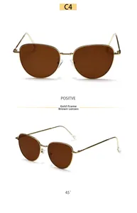 Detail of gold metal cat-eye sunglasses with brown lenses from front and side angles