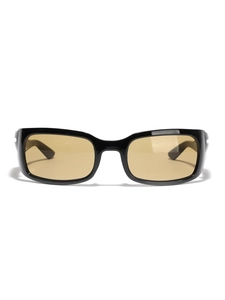 Retro futuristic narrow square sunglasses with black frames and translucent amber lenses