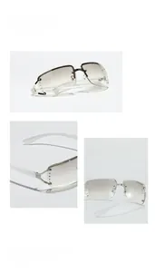 Close-up of Y2K rimless square sunglasses with gradient brown lenses and silver rivets