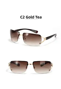 Close-up of frameless Y2K square sunglasses with gold metal frame and rhinestones