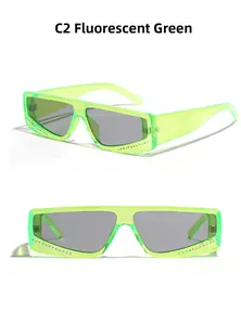 Detail view of square neon green frame sunglasses with rhinestones and grey lenses