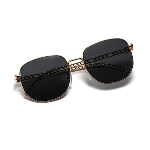 Square oversized sunglasses with gold chain temples and dark lenses for a trendy look