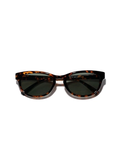 Tortoiseshell cat-eye sunglasses with metal accents and dark lenses on white background