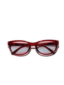 Retro cat-eye sunglasses with translucent red frames and gradient blue-to-pink lenses