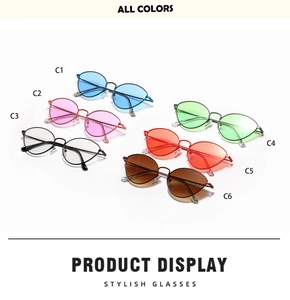 Flat lay of vintage cat-eye metal sunglasses in six vibrant ocean-tinted colors