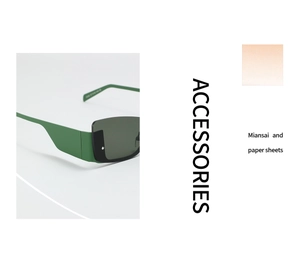 Close-up of retro square sunglasses with wide green temples and metal rivet details
