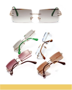 Detail view of colorful rimless rectangle sunglasses with gradient lenses and gold metal frames