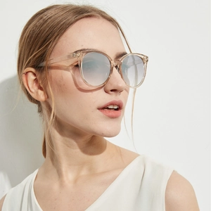 Vintage round sunglasses with champagne transparent frames and blue gradient lenses