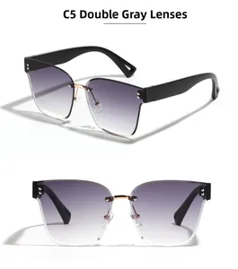 Detail view of C5 rimless square sunglasses with grey gradient lenses and gold accents