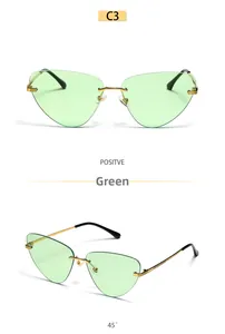 Lunettes de soleil œil-de-chat géométriques sans monture vert clair et branches dorées