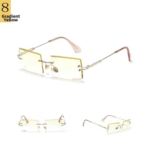 Detail view of rimless rectangular sunglasses featuring gradient yellow lenses and gold temples