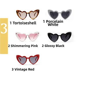 Close-up of heart-shaped sunglasses in leopard, white, pink, black and red colors