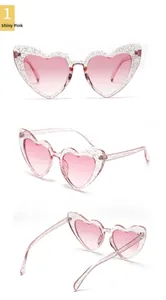 Detailed view of sparkling pink heart sunglasses with glitter resin and gradient lenses