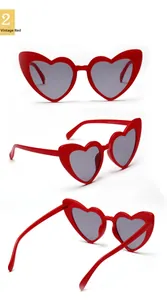 Detailed views of vintage red heart sunglasses with dark lenses and durable frames