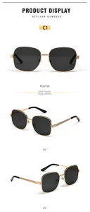 Detail of oval metal frame sunglasses with grey lenses and adjustable nose pads