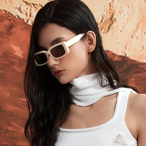 Fashion rectangular sunglasses with off-white frame and dark lenses on a model