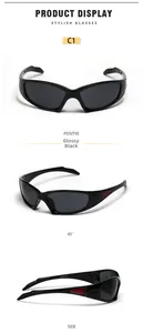 Close-up of glossy black Y2K wrap-around sunglasses with red side accents and relief logo