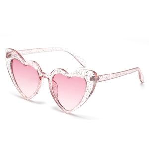 Pink heart-shaped sunglasses with glitter frame and gradient lenses shown at 45 degrees