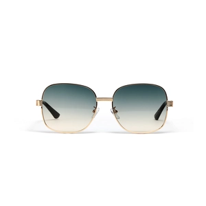 Fashionable oversized oval metal sunglasses with gold frame and gradient teal lenses