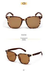Detail view of square tortoiseshell sunglasses with brown lenses and wooden temples