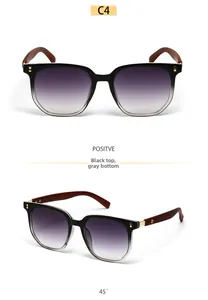 Detail of square sunglasses with black gradient lenses and redwood grain textured temples