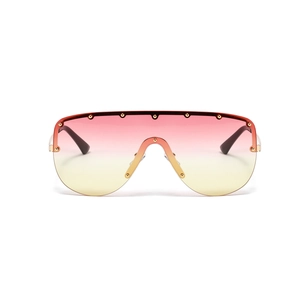 Pink and yellow gradient rimless sunglasses with gold rivet accents on white background