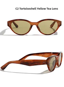 Close-up of tortoiseshell cat-eye sunglasses with yellow-brown lenses and model number detail