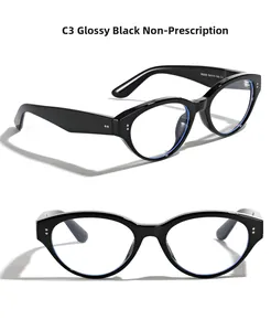 Detail view of glossy black cat-eye frames with silver dot accents and clear lenses