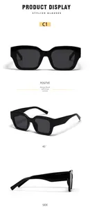 Detailed views of glossy black oversized rectangular sunglasses with dark grey lenses
