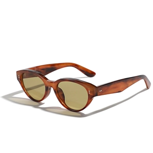 Retro tortoise cat-eye sunglasses with yellow tinted lenses and silver rivet details