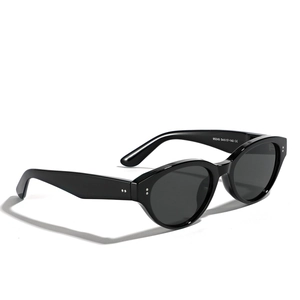 Vintage oval cat-eye sunglasses in black with silver rivet details and dark lenses