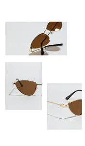 Détails de lunettes de soleil œil de chat dorées avec verres bruns et branches fines