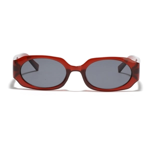Retro oval sunglasses with translucent dark red frames and black lenses on white background
