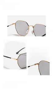 Detailed macro view of gold metal octagonal frame hinges and nose pads on sunglasses