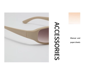Detailaufnahme der cremefarbenen Sonnenbrille mit rosa Verlaufsgläsern und Matt-Finish