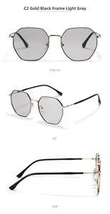 Detail view of octagon metal sunglasses in gold black frame with light grey lenses