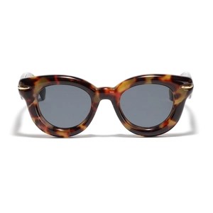 Vintage tortoiseshell cat eye sunglasses with dark grey lenses and gold metal accents