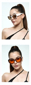 Detail of chunky square Y2K sunglasses in white and dark frames with vibrant lenses