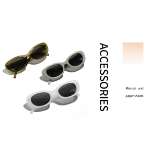 Three pairs of vintage oval sunglasses in amber, grey, and white with thick frames