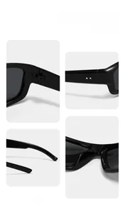 Close-up of glossy black Y2K sunglasses with metal hinges and double dot ornaments