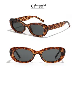 Detail of tortoise grey oval sunglasses with UV protection and vintage thick frames