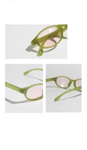 Dettaglio degli occhiali da sole ovali retrò con montatura verde e rivetti delle cerniere