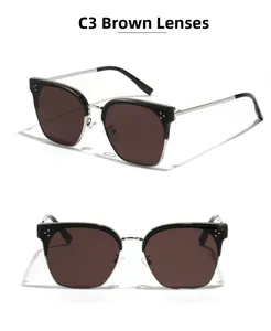 Detailansicht der Cat-Eye-Sonnenbrille mit braunen Gläsern und Metallnietenrahmen