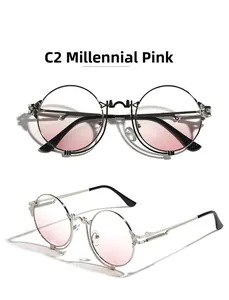 Detail view of round metal steampunk sunglasses with C2 Millennial Pink gradient lenses