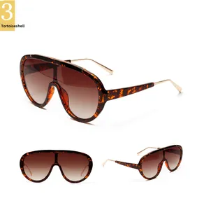 Detail view of tortoiseshell aviator sunglasses with gradient brown lenses and gold temples